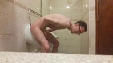 Very skinny teen masturbates in public bathroom urinal