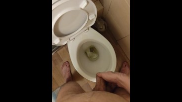 Skinny teen with erected cock takes a piss