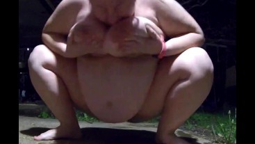 Chubby slut wife peeing outside in front of security cam pissing and touching her huge breasts 2