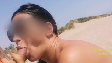 She sucks my cock on the public beach at sea and pees on it, milf conquered on the beach