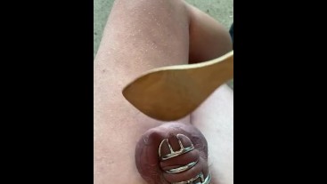 Caged boy gets his balls busted with wooden spoon