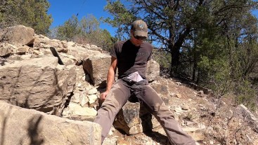 Pissing grey pants and white briefs in the mountains
