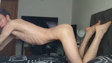 Extremely skinny lad bends over on his bed and shows off his skinny Perfect body
