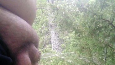Fat man with beutiful uncut cock pisses clear nectar in nature while wife watches him